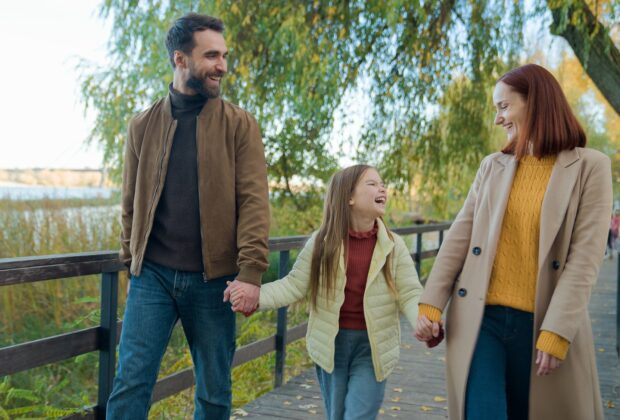 Caucasian happy family weekend holiday at nature outdoors laughing smiling in city autumn park