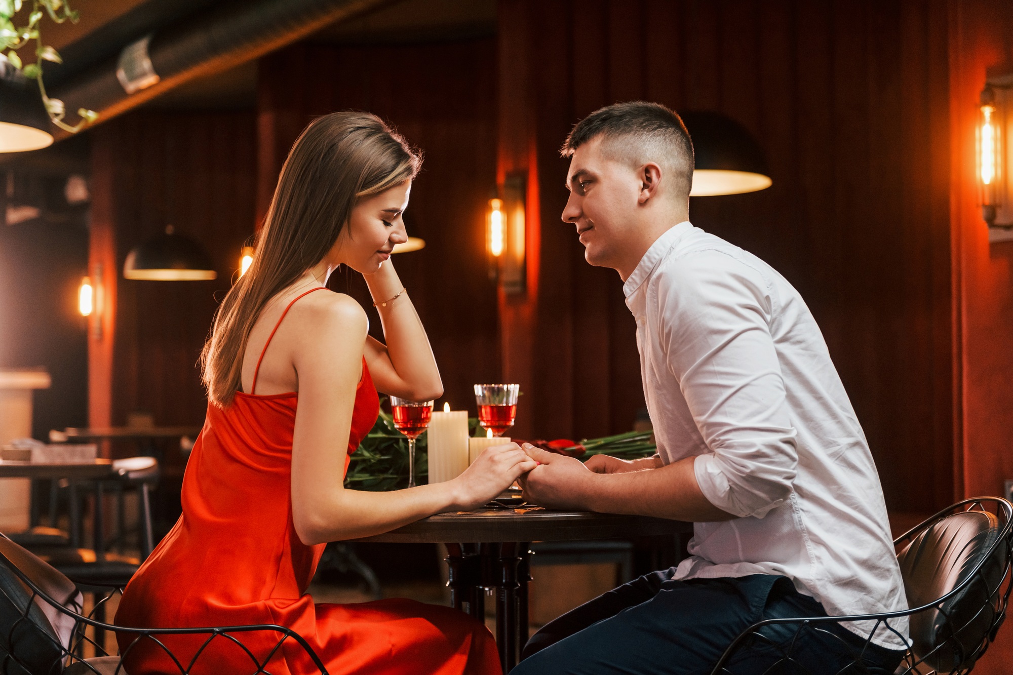 Side view. Romantic couple have dinner in the restaurant