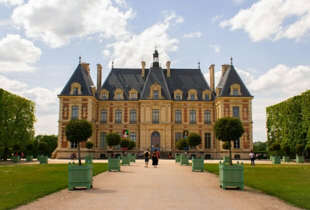 a large building with a lot of trees in front of it