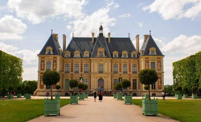 a large building with a lot of trees in front of it
